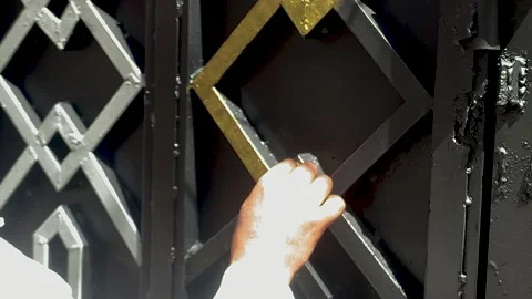 Adding golden paint to black door shapes Stock Footage 232994937