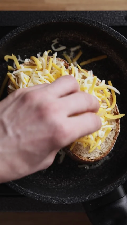 Adding Grated Cheese On Bread Top View Stockbeeldmateriaal 332358416