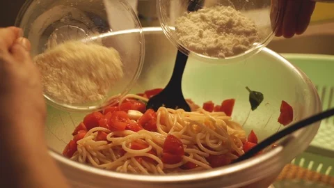 Adding Grated Parmesan Cheese to Pasta Video stock 99248103
