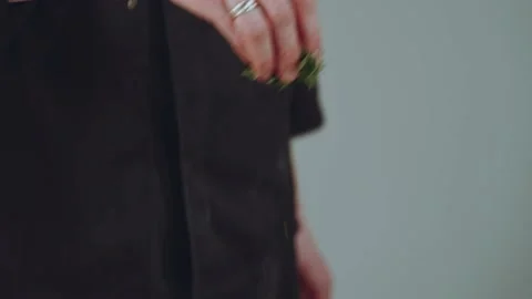 Adding greens to the pan, the greens fall in slow motion Stock Footage 233888570