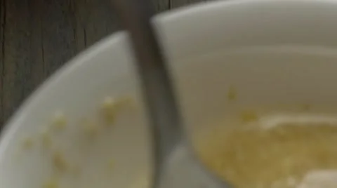 Adding ground flaxseed dissolved in water to bowl of dry baking ingredients f Stock Footage 61846854