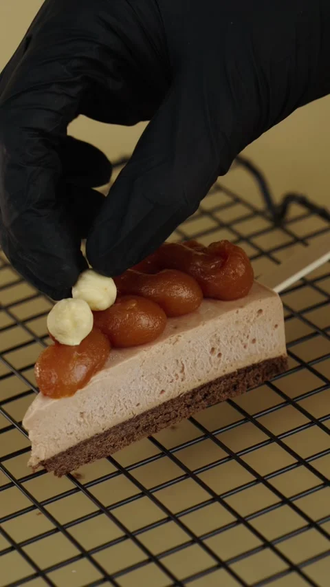 Adding Hazelnuts to Cheesecake Slice Stock Footage 342039362