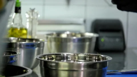 Adding Herbs to the Meat Dish Stock Footage 132170835