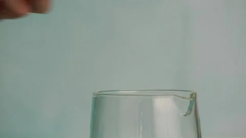 Adding honey to a glass jar Stock Footage 132149633