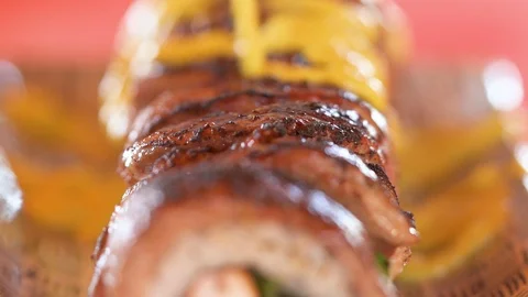 Adding huancaina sauce to sushi roll Stock Footage 90299549