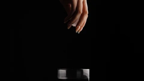 Adding ice in alcohol in glass Stock Footage 100965554