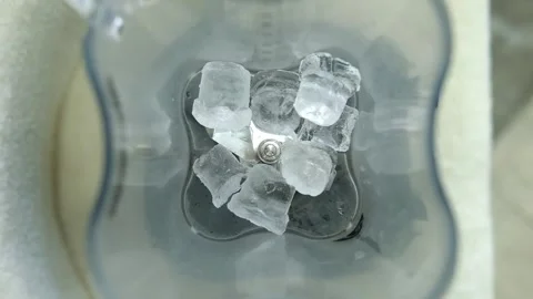Adding ice cubes in blender, making iced coffee beverage. Stock Footage 307275108