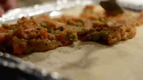 Adding Indian Masala on to Pizza Dough Stock Footage 130355514