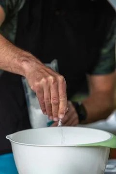 Adding Ingredients to Bowl Stock Photos