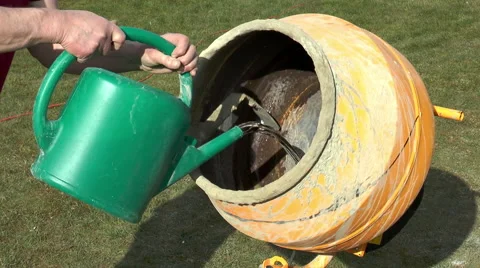 Adding ingredients to concrete mixer. Stock Footage 47957982