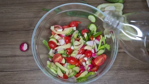 Adding Ingredients Into Salad. Cooking Vegetable Salad. Video stock 165505533