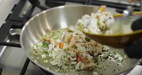 Adding Ingredients to Silver Frying Pan Video stock 195757996