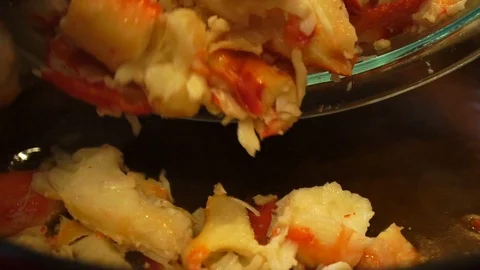 Adding juicy crab meat to gumbo stew, Slow Motion Close Up Stock Footage 102189231