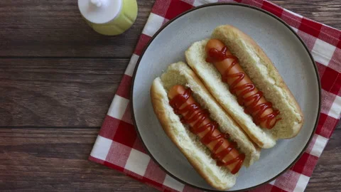 Adding Ketchup to Hot Dogs Stock Footage 131349254