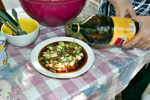 Adding kvass to okroshka Stock Photos