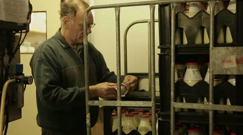 Adding labels to bottles milk Stock Footage 35330759