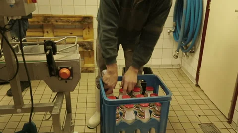 Adding labels to bottles milk Video stock 35330774
