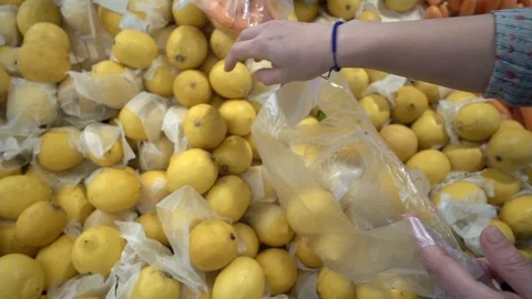Adding Lemon to Nylon Pochette Stock Footage 106222444