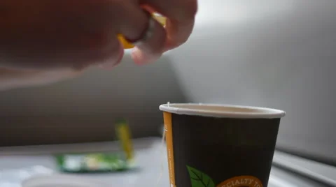 Adding liquid lemon to tea on the train Video stock 58232613