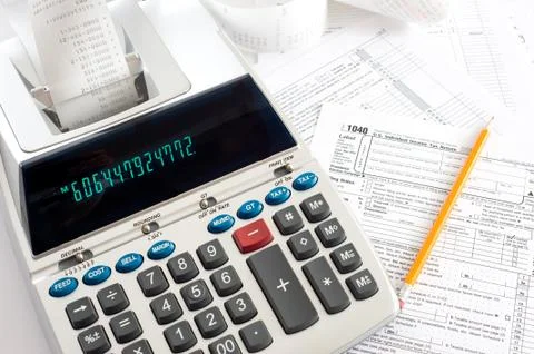 Adding machine with tax forms Stock Photos