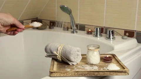 Adding Magnesium Chloride vitamin salt in foot bath water, solution. Stock-Footage 147329302