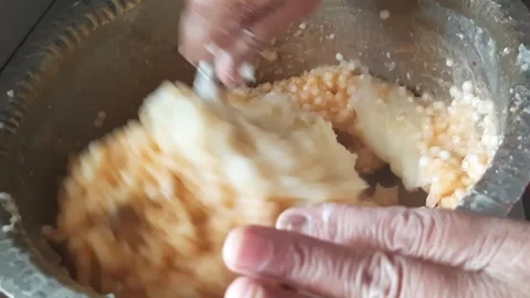 Adding Mashed Potatoes to Sabudana Mixture – Indian Chakli Preparation Step Video stock 333047232