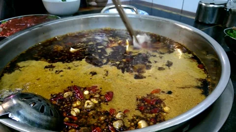 Adding meat to a boiling hot pot, so called huoguo Stock Footage 44463942