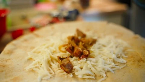 Adding meat to cheese in pita bread, close-up Stock Footage 310765717