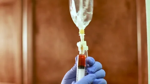 Adding Medicine for the IV treatment. Stock Footage 89111597