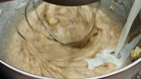 Adding Milk to Baking Ingredients Stock-Footage 138335621