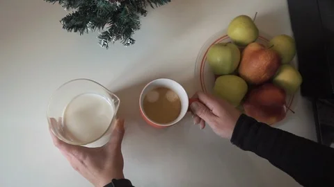 Adding milk to coffee Stock Footage 110913691