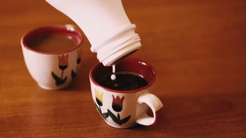 Adding milk to the coffee to make macchiato. Stock Footage 149438542