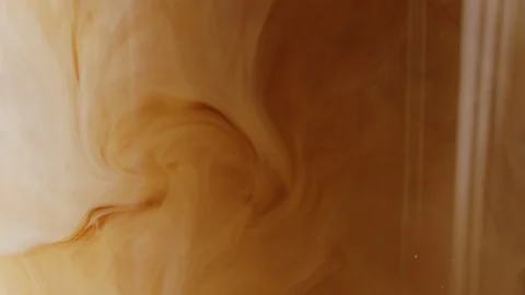 Adding milk in glass with coffee and ice macro shot Stock-Footage 128491389