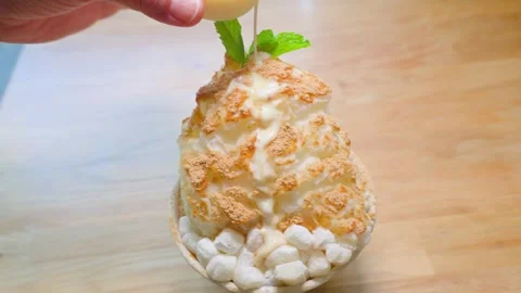 Adding Milk to Scooping  Korean Shaved Ice Stock Footage 309509952