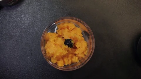 Adding milk to squash Stock Footage 97410445