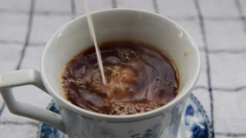 Adding milk to tea. Stock Footage 148987646