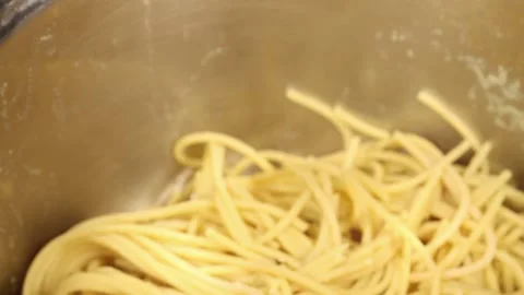 Adding mince mixture to low carb pasta Stock Footage 156028134