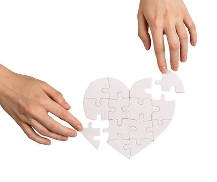 Adding missing puzzle pieces to complete love heart, repair romantic relati.. Stock Photos