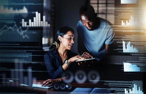 Adding modifications to their plans. Shot of two programmers using a digital  스톡 사진