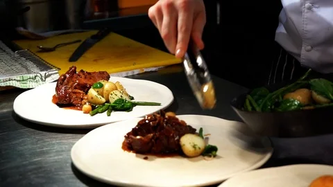 Adding more food to the plate Stock Footage 107164815