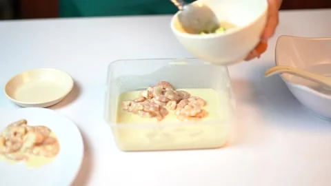 Adding More Fresh Shrimps into Creamy Marinade for Deep Frying 스톡 동영상 334322346