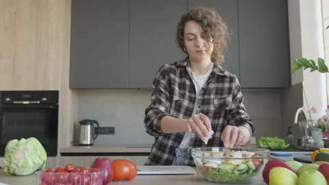 Adding Mozzarella To Salad Bowl In Bright Kitchen For Healthy Homemade Meal Stock Footage 308455317