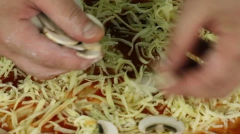 Adding mushrooms to pizza Stock Footage 52487648