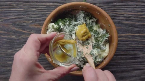 Adding Mustard to Dill and Butter Mix. Making Herb Butter Stock Footage 315702759