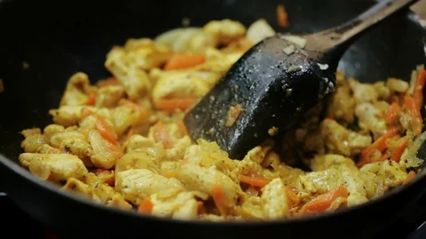 Adding noodles to chicken Stock Footage 98361670