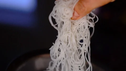 Adding Noodles To Rice Noodle Spring Roll in Slow Motion Closeup Stock Footage 125339296