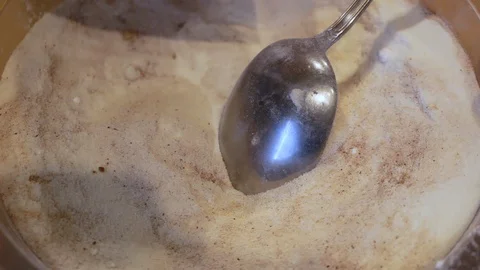Adding nuts for a cake mixture Stock Footage 107755304