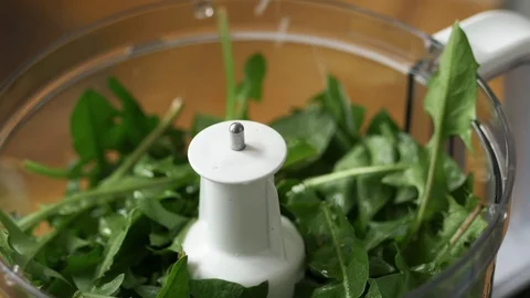 Adding oil and lemon juice into a food processor Stock Footage 74307406