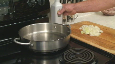Adding oil and onion Stock Footage 662818