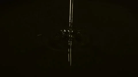 Adding an oil on black pan close-up. Chef going to cook food on a boiling pan Stock Footage 279759043